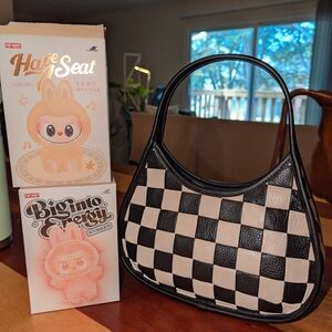 Elegant Black and Cream Checkered Coachtopia Ergo Bag